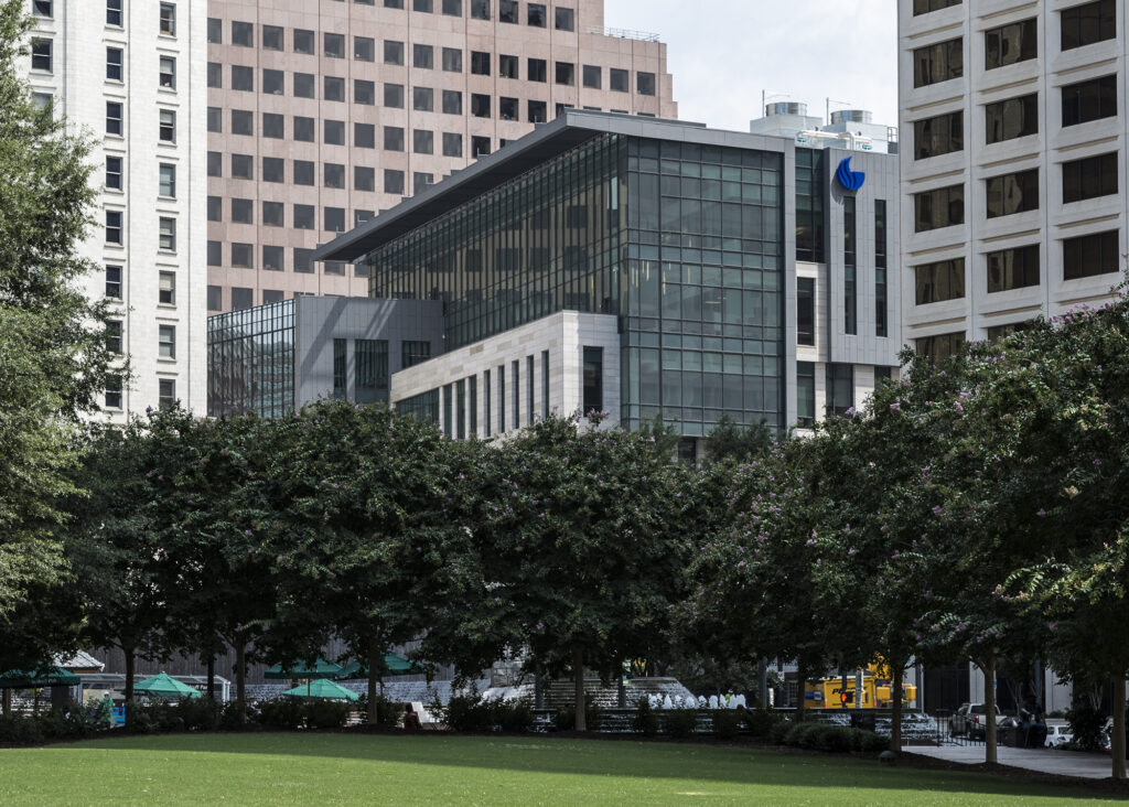Georgia State University Law in downtown Atlanta. A glass and concrete building stands on the edge of a green park